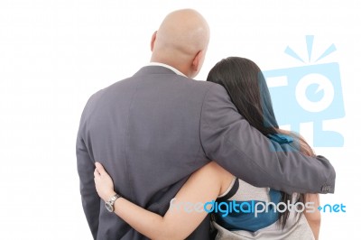 Back View Of Couple Hug And Look Into A Distance. Formal Guy And… Stock Photo