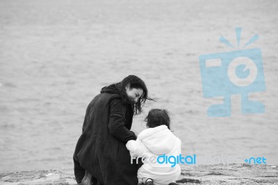 Back View Of Mother And Daughter Stock Photo