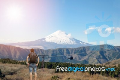 Backpacker Standing And Looking At The Mount Fuji Stock Photo