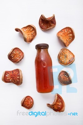 Bael Dried And Bael Juices On White Wooden Background Stock Photo