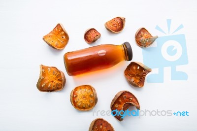 Bael Dried And Bael Juices On White Wooden Background Stock Photo