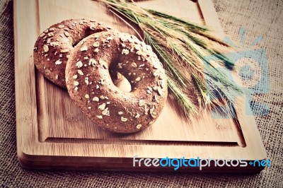 Bagels On Bread Board Stock Photo