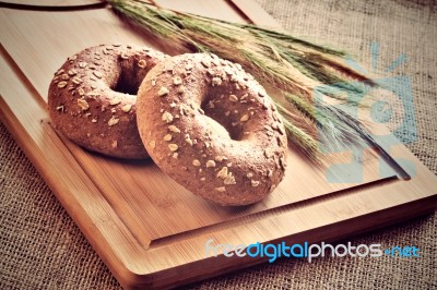 Bagels On Bread Board Stock Photo