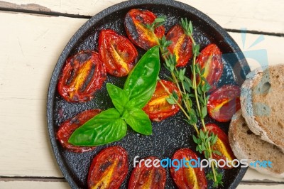 Baked Cherry Tomatoes With Basil And Thyme Stock Photo