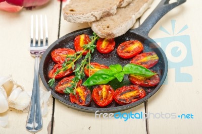 Baked Cherry Tomatoes With Basil And Thyme Stock Photo