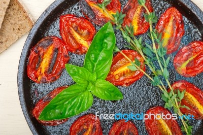 Baked Cherry Tomatoes With Basil And Thyme Stock Photo