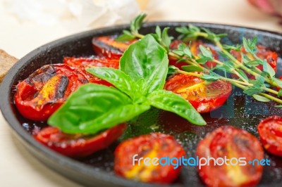 Baked Cherry Tomatoes With Basil And Thyme Stock Photo