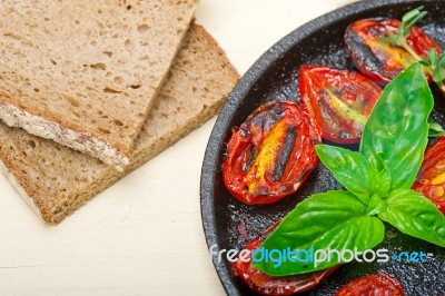 Baked Cherry Tomatoes With Basil And Thyme Stock Photo