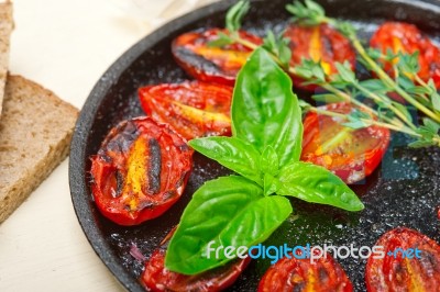 Baked Cherry Tomatoes With Basil And Thyme Stock Photo