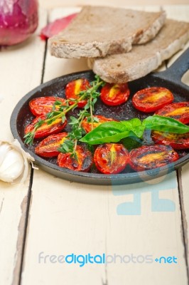 Baked Cherry Tomatoes With Basil And Thyme Stock Photo