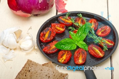 Baked Cherry Tomatoes With Basil And Thyme Stock Photo