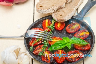 Baked Cherry Tomatoes With Basil And Thyme Stock Photo