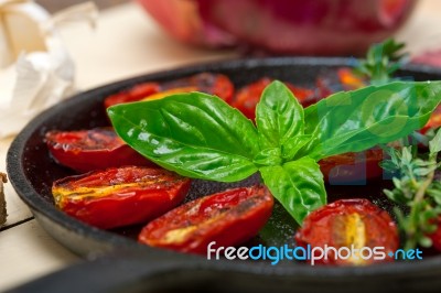 Baked Cherry Tomatoes With Basil And Thyme Stock Photo