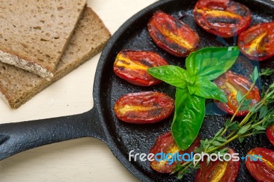 Baked Cherry Tomatoes With Basil And Thyme Stock Photo