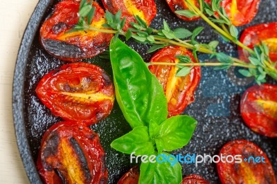 Baked Cherry Tomatoes With Basil And Thyme Stock Photo