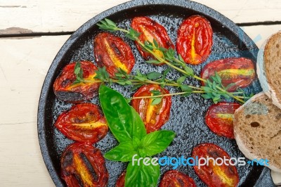 Baked Cherry Tomatoes With Basil And Thyme Stock Photo