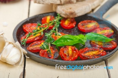 Baked Cherry Tomatoes With Basil And Thyme Stock Photo