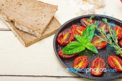 Baked Cherry Tomatoes With Basil And Thyme Stock Photo