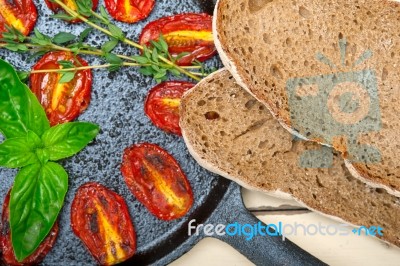 Baked Cherry Tomatoes With Basil And Thyme Stock Photo