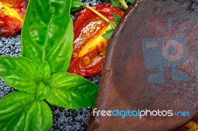 Baked Cherry Tomatoes With Basil And Thyme Stock Photo