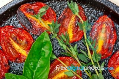 Baked Cherry Tomatoes With Basil And Thyme Stock Photo