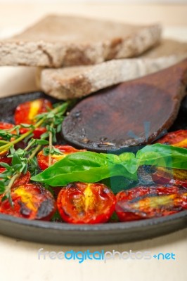 Baked Cherry Tomatoes With Basil Anf Thyme Stock Photo