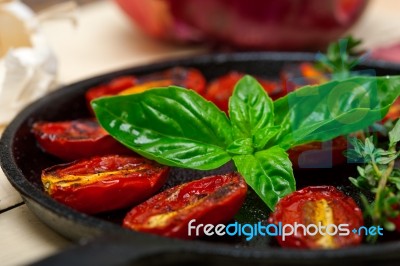 Baked Cherry Tomatoes With Basil Anf Thyme Stock Photo