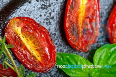 Baked Cherry Tomatoes With Basil Anf Thyme Stock Photo