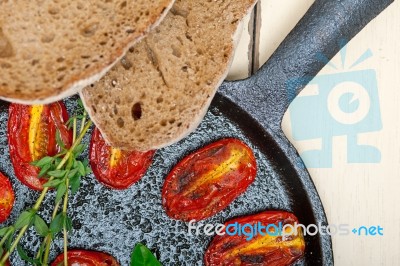 Baked Cherry Tomatoes With Basil Anf Thyme Stock Photo