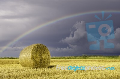 Bale Of Hay And Rainbow Stock Photo