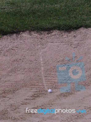 Ball In Sand Trap Stock Photo