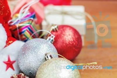 Balls And Gift On Wooden Stock Photo