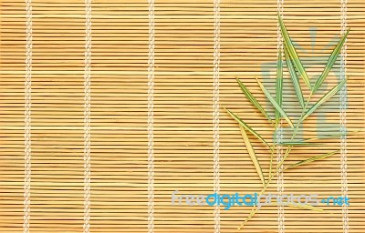 Bamboo Leaves On Bamboo Mat Stock Photo