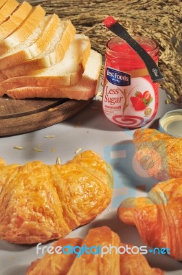 Bangkok Thailand - December 11 :  Strawberry Jam Of Best Food Brand With Croissant And Sliced Breads On Table In Bangkok Thailand On December 11, 2013 Stock Photo