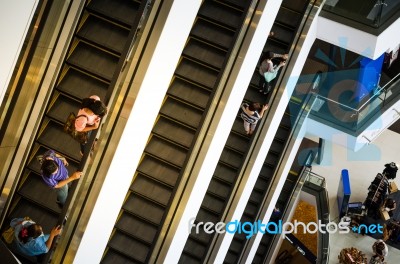 Bangkok, Thailand - September 12, 2013: Shoppers On Escalator At… Stock Photo