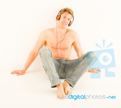 Bare Chested Man With Headphones Stock Photo