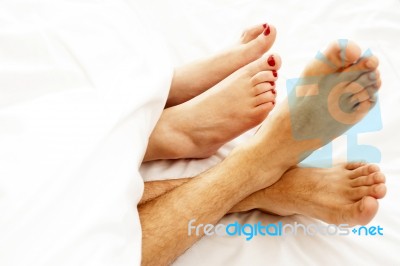 Bare Feet Of Couple Stock Photo