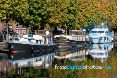 Barges Moored In Bruges West Flanders Belgium Stock Photo