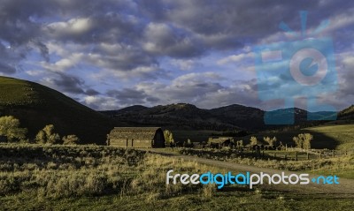 Barn On The Hill In The Morning Sun At Yellowstone National Park… Stock Photo