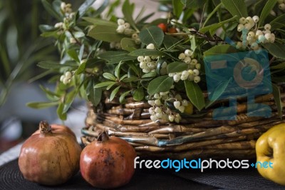 Basket With Strawberry Tree Branches Stock Photo