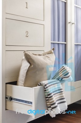 Bath Towel And Pillow In Wardrobe Stock Photo