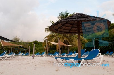 Beach Chairs And Umbrella Stock Photo