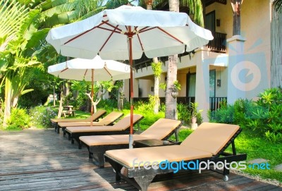 Beach Chairs And Umbrella Stock Photo