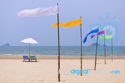 Beach Chairs And White Umbrella Stock Photo