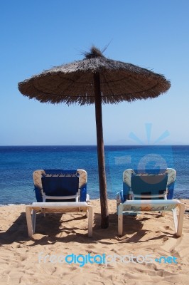 Beach Chairs On Perfect Sand Beach Stock Photo