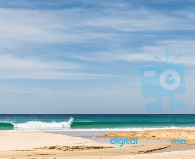 Beach, Sea And Cloudy Blue Sky Stock Photo