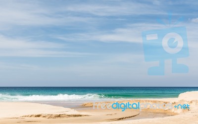 Beach, Sea And Cloudy Blue Sky Stock Photo