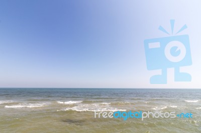 Beach With Blue Sky Background Stock Photo