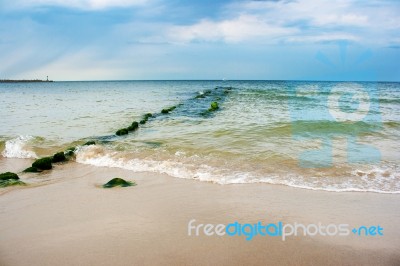 Beach With Breakwater Stock Photo