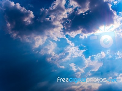 Beam Of Sunlight Behind Dark Clouds In The Countryside Stock Photo